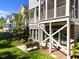 Rear exterior view of home featuring a screened-in porch and lush backyard at 1000 Norris St, Raleigh, NC 27604