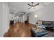 Open living room with hardwood floors, ceiling fans, and neutral walls at 1000 Norris St, Raleigh, NC 27604