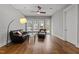 Living room with hardwood floors, modern furniture, and plenty of natural light at 1000 Norris St, Raleigh, NC 27604