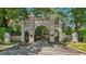 Historic stone gate with intricate detailing, surrounded by lush greenery at 1000 Norris St, Raleigh, NC 27604