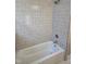 Clean bathroom with patterned tile and bathtub at 1014 E Jones St, Raleigh, NC 27601