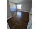 Spacious bedroom with hardwood floors and large windows at 1014 E Jones St, Raleigh, NC 27601