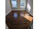 Bright bedroom featuring hardwood floors and natural light at 1014 E Jones St, Raleigh, NC 27601