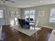 Bright dining room with hardwood floors and large windows providing ample natural light at 1014 E Jones St, Raleigh, NC 27601