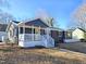 Charming ranch home with updated brick exterior, welcoming porch, and landscaped yard at 1014 E Jones St, Raleigh, NC 27601