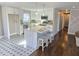 Updated kitchen with white cabinetry, center island, and stainless steel appliances at 1014 E Jones St, Raleigh, NC 27601