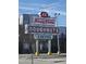 Iconic Krispy Kreme Doughnuts and Coffee sign at 1014 E Jones St, Raleigh, NC 27601