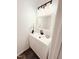 Clean bathroom with a white vanity, black faucet, modern lighting, and decorative accents at 103 Cimmaron Ct, Cary, NC 27511