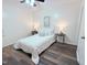 Bright bedroom with a ceiling fan, bedside tables, and a comfortable white bed at 103 Cimmaron Ct, Cary, NC 27511