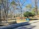 Scenic neighborhood view with lush trees, green spaces, and outdoor amenities at 103 Cimmaron Ct, Cary, NC 27511