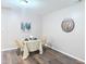 Charming dining area with wood floors, seating for two, and neutral decor, creating an intimate space at 103 Cimmaron Ct, Cary, NC 27511