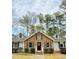 Charming brick home featuring black shutters, dormer windows, and a welcoming front door with a wreath at 103 Cimmaron Ct, Cary, NC 27511