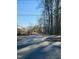 Community greenway entrance with paved path surrounded by natural beauty at 103 Cimmaron Ct, Cary, NC 27511