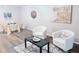 Comfortable seating area with modern decor, a black coffee table, and a dining area with wood floors at 103 Cimmaron Ct, Cary, NC 27511