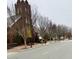Picturesque street view of a church exterior and trees, complemented by sidewalks and street lamps at 103 Cimmaron Ct, Cary, NC 27511
