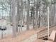 Street view with trees and a glimpses of neighborhood houses at 103 Cimmaron Ct, Cary, NC 27511