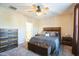 Spacious bedroom with ceiling fan, dresser, and a comfy bed at 1206 Newton Dr., Mebane, NC 27302
