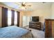 Large bedroom with a king bed, dresser, and TV at 1206 Newton Dr., Mebane, NC 27302