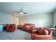 Versatile bonus room featuring leather seating and a home entertainment center at 1206 Newton Dr., Mebane, NC 27302