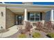 Covered front porch with brick columns and a charming sitting area at 1206 Newton Dr., Mebane, NC 27302