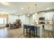 Modern kitchen features white cabinets, granite island, and stainless steel appliances at 1206 Newton Dr., Mebane, NC 27302
