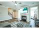 Spacious living room with a fireplace, large TV, and comfortable seating at 1206 Newton Dr., Mebane, NC 27302