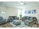 Cozy living room featuring a sectional sofa, ottoman, and hardwood floors at 1206 Newton Dr., Mebane, NC 27302