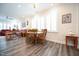 Dining room with a wooden table set and bright light from the shuttered windows at 125 Canary Ct. Ct, Raleigh, NC 27610