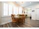 Bright dining room with a wooden table set and shuttered windows at 125 Canary Ct. Ct, Raleigh, NC 27610
