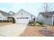 Well-maintained home with a two-car garage, nice landscaping, and a neatly manicured lawn at 125 Canary Ct. Ct, Raleigh, NC 27610
