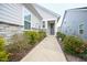Charming home featuring a welcoming gray front door and well-maintained landscaping at 125 Canary Ct. Ct, Raleigh, NC 27610