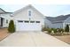 Spacious two car garage with clean driveway and partial stone exterior at 125 Canary Ct. Ct, Raleigh, NC 27610