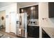 Well-lit kitchen featuring stainless steel appliances, granite countertops and dark cabinets at 125 Canary Ct. Ct, Raleigh, NC 27610