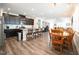 Open-concept kitchen flows into the dining area with modern appliances and dark cabinetry at 125 Canary Ct. Ct, Raleigh, NC 27610