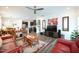 Comfortable living room with dark wood accents, and open access to the kitchen and dining area at 125 Canary Ct. Ct, Raleigh, NC 27610