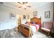 Inviting bedroom with neutral walls, ceiling fan and view to the ensuite bathroom at 125 Canary Ct. Ct, Raleigh, NC 27610