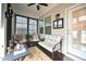 Cozy sunroom with a ceiling fan, furniture, and many windows overlooking the backyard at 125 Canary Ct. Ct, Raleigh, NC 27610