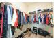 Spacious walk-in closet with an organized storage system for shoes and clothing at 125 Canary Ct. Ct, Raleigh, NC 27610