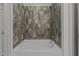 Bathroom with shower and grey tile at 1300 St Marys St # 404, Raleigh, NC 27605