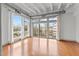 Hardwood floor bedroom with large windows and city view at 1300 St Marys St # 404, Raleigh, NC 27605
