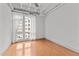 Second bedroom with hardwood floors and large windows at 1300 St Marys St # 404, Raleigh, NC 27605