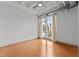 Well-lit bedroom featuring hardwood floors and a window with city views at 1300 St Marys St # 404, Raleigh, NC 27605