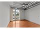Spacious bedroom with hardwood floors and large window at 1300 St Marys St # 404, Raleigh, NC 27605