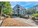 Modern building exterior with a pool and ample parking at 1300 St Marys St # 404, Raleigh, NC 27605