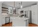 Modern kitchen with island and stainless steel appliances at 1300 St Marys St # 404, Raleigh, NC 27605