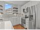 Modern kitchen with stainless steel appliances and white cabinets at 1300 St Marys St # 404, Raleigh, NC 27605
