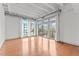 Spacious living room with hardwood floors and large windows at 1300 St Marys St # 404, Raleigh, NC 27605