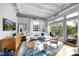 Spacious living room with hardwood floors and access to a balcony at 1300 St Marys St # 404, Raleigh, NC 27605