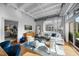 Spacious living room with hardwood floors and city views at 1300 St Marys St # 404, Raleigh, NC 27605