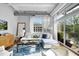 Bright living room with hardwood floors and large windows at 1300 St Marys St # 404, Raleigh, NC 27605